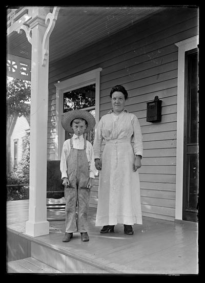 Woman with boy in straw hat