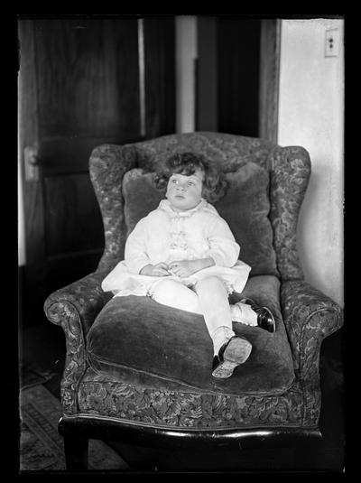 Girl in big chair