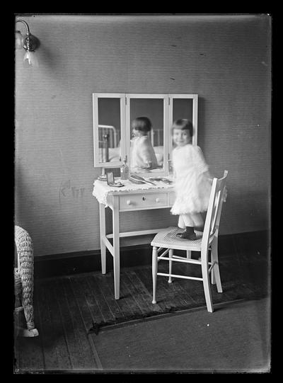 Girl at dressing table