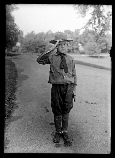 Boy scout saluting