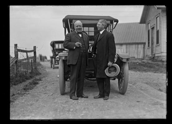 F. Paul Anderson and Kastle in front of car