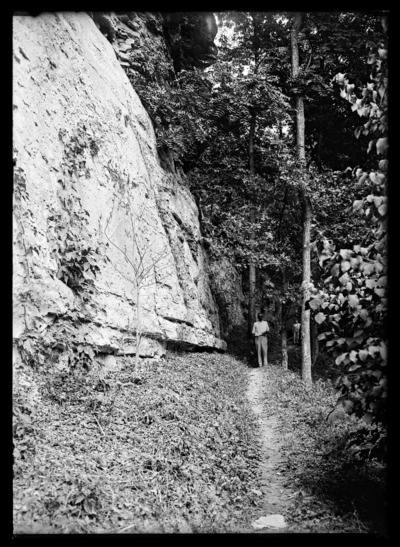 Man and boy, high cliffs