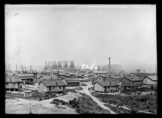 Housing project with industrial plant in background