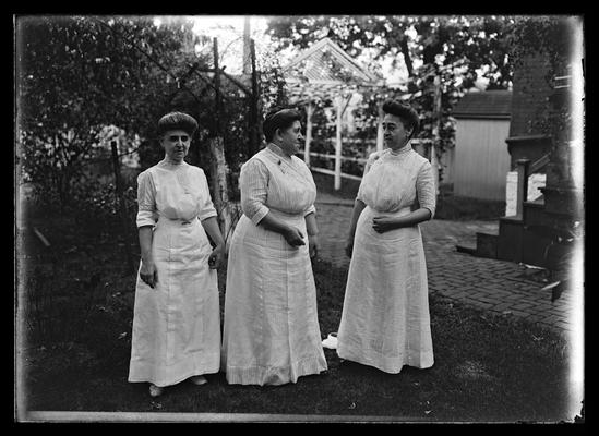 Three women in backyard