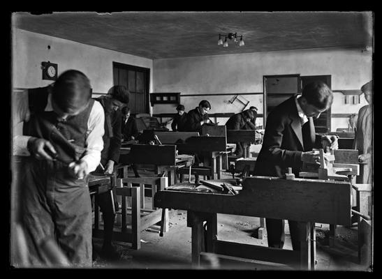 Nine young men in wood shop, school unknown