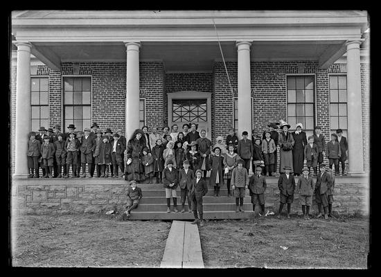 Greendale School (?), children and teachers in coats on porch