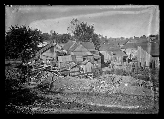 Lexington, City Engineers Office, houses, board across stream