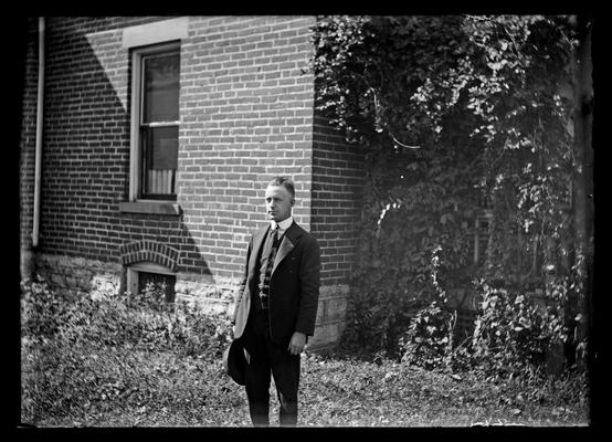 City Engineers Office, young man by corner of house