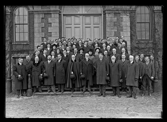 University of Kentucky faculty group on steps of Administration Building (Main Building) during President Barker's administration, hats off