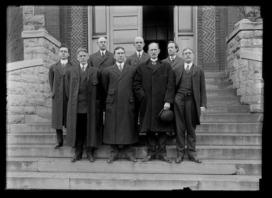 Law Faculty, eight men, Dean Lafferty, second from right, first row, Mr. George Vaughn, right of back row