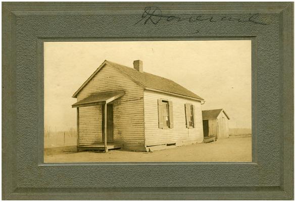 Exterior of Donerail school house. Handwriting on verso. (Two copies)