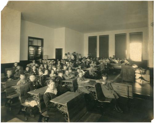 Group portrait of Greendale students sitting at their desks. Handwritten on verso, The Chapel at Greendale School, Fayette County Ky