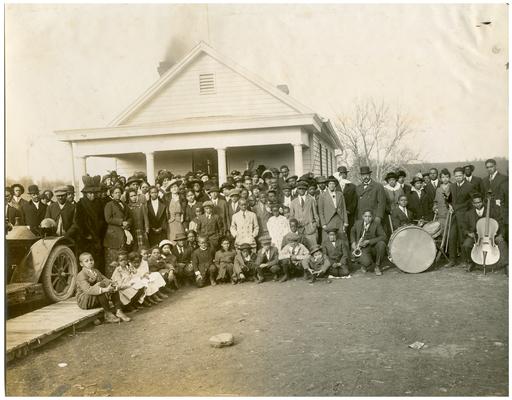 Group portrait of Nannie Faulconer (1865?-1940) and crowd in front of Brecktown school for the dedication