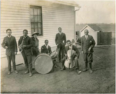 Group portrait of Nannie Faulconer (1865?-1940) with instrumental ensemble which played for Brecktown's dedication (Two copies)