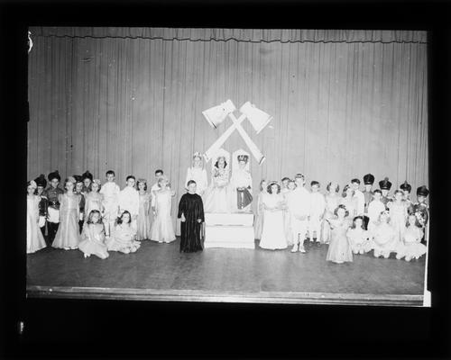 Elementary school students on stage in costume