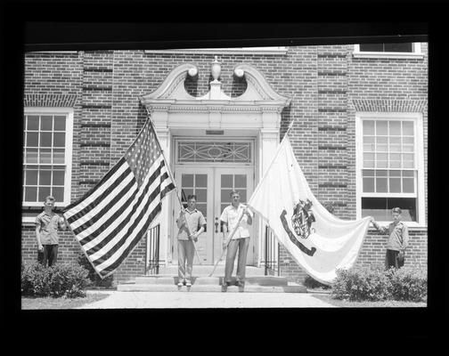 Senior High School Hi-Y members with flags group purchased for school