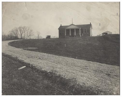 Exterior of the Picadome school house (A). Handwritten on verso, Picadome, The old Haynes. Mrs. Nannie Faulconer Supt