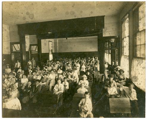 Picadome students seated with parents at desks