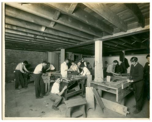 Picadome boys in woodworking class with Nannie Faulconer (1865?-1940) and Orville Croder. (Two copies)