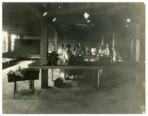 Group portrait of Picadome girls preparing lunch with Nanny Faulconer (1865?-1940)