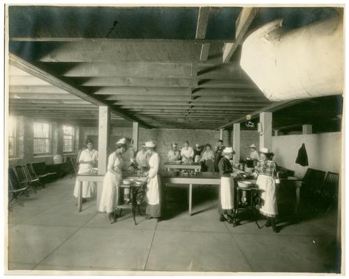 Picadome girls preparing lunch with Nannie Faulconer (1865?-1940). Handwritten on verso, Picadome 5 copies