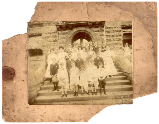 Group portrait of the graduating class of 1908 with Mrs. Nannie Faulconer (1865?-1940)