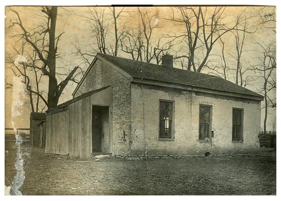 Exterior of an unidentified school house which was abandoned for consolidated schools