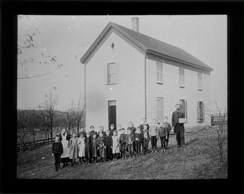 Students outside Fort Springs School with Mr. T.P. Throop, teacher