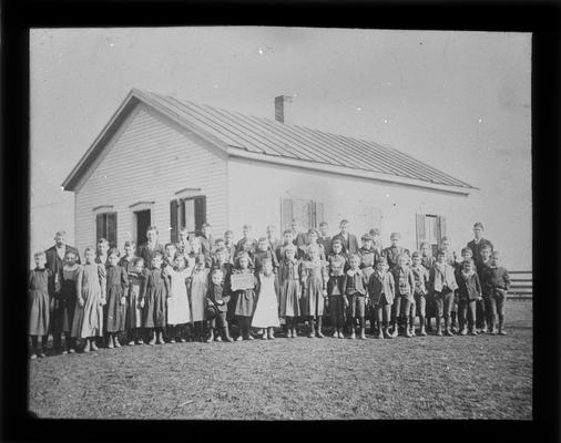Students outside Chilesburg School with Mr. Charlie G. Stephenson, teacher
