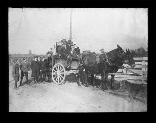 Students and Mrs. Nannie Faulconer with farm wagon used to transport students to Greendale School