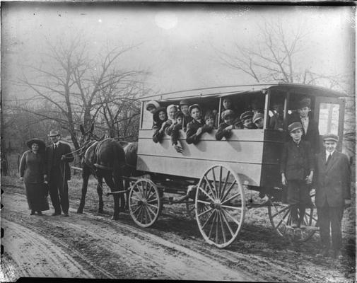 Students in school wagon with Mrs. Nannie Faulconer and Mr. Sam Brooks, driver