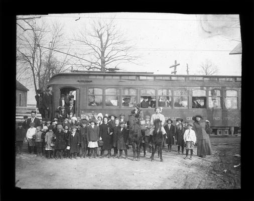 Students on trolley like those used to transport students on Georgetown and Paris Pikes