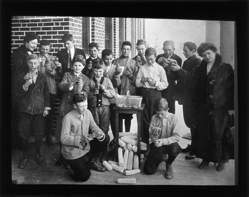 Picadome high school boys and Mrs. Nannie Faulconer with seed corn and potatoes