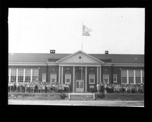 Exterior view of Walnut Hill School with students standing outside