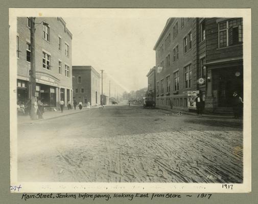 Title handwritten on photograph mounting: Main Street, Jenkins, before paving, looking East from Store