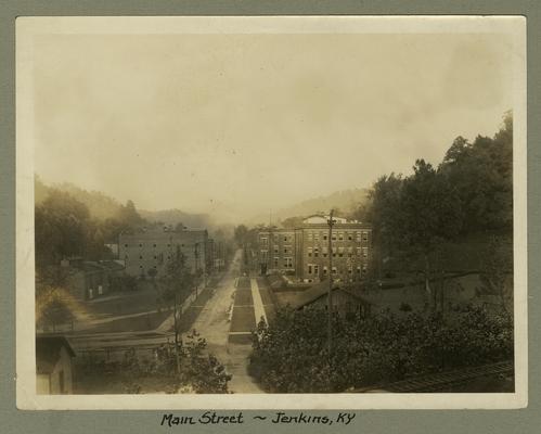 Title handwritten on photograph mounting: Main Street--Jenkins, Kentucky