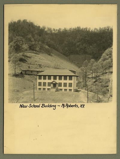 Title handwritten on photograph mounting: New School Building--McRoberts, Kentucky