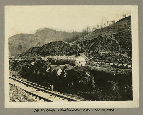 Title handwritten on photograph mounting: No. 201 Slide--Buried Locomotive