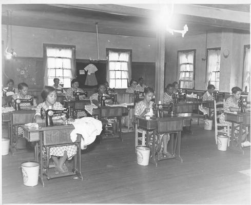 Winchester - The best garment made daily is placed on the bulletin board in this workroom