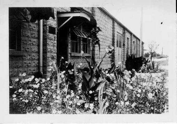 Flower beds in front of WPA Warehouse and Office, Danville, 1941