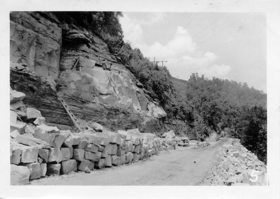 Quarrying bridge stone along new grade and drain project