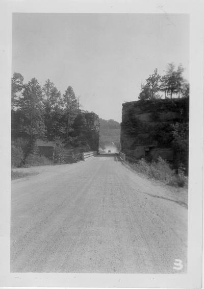 Cut in hill (rifle sight) on state highway in Johnson County built by WPA, 1940