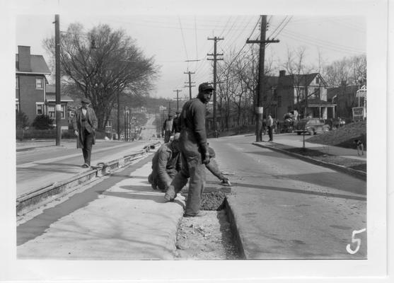 WPA workers removing street car rails in Covington