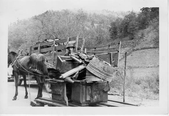 James Nipper delivering his scrap by wooden sled near Mousie, KY, 1942. WPA collection truck in background