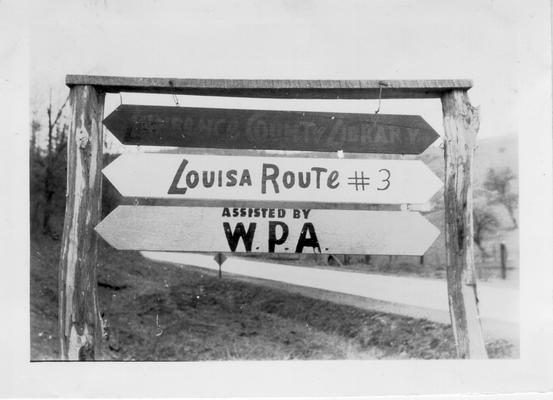 Red, white and blue Packhorse Library sign outside Louisa, 1941