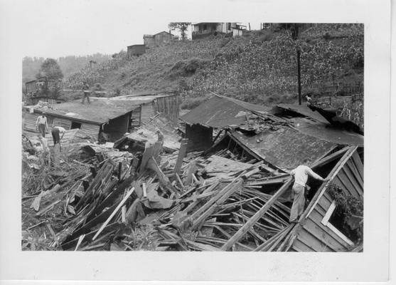 Demolished house washed against railroad bridge at Whitaker, KY during flash flood of July 9, 1942