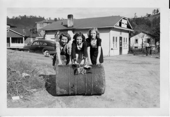 School girls rolling metal drum to scrap stockpile in Combs, KY, October, 1942