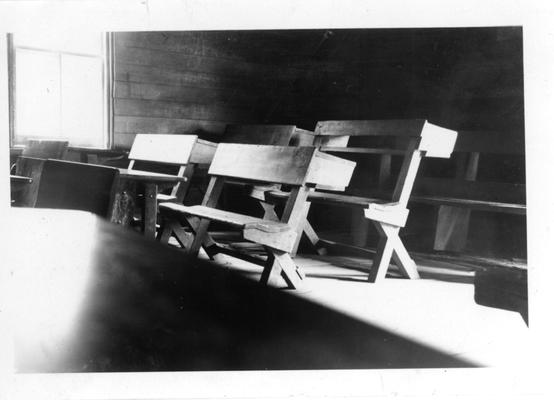 Benches and desks in Log Cabin School