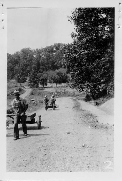 Project #2-27-147-761 Cumberland City Road. WPA workers pulling carts up road