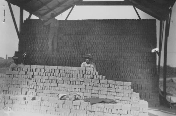 Project #1-73-27-68 District 1, Branch District 3. Photograph 4 in a series showing the various steps in manufacturing brick to be used in building a 10' wall around the Keiler Athletic Field in Paducah, KY. Bricks being stacked in 